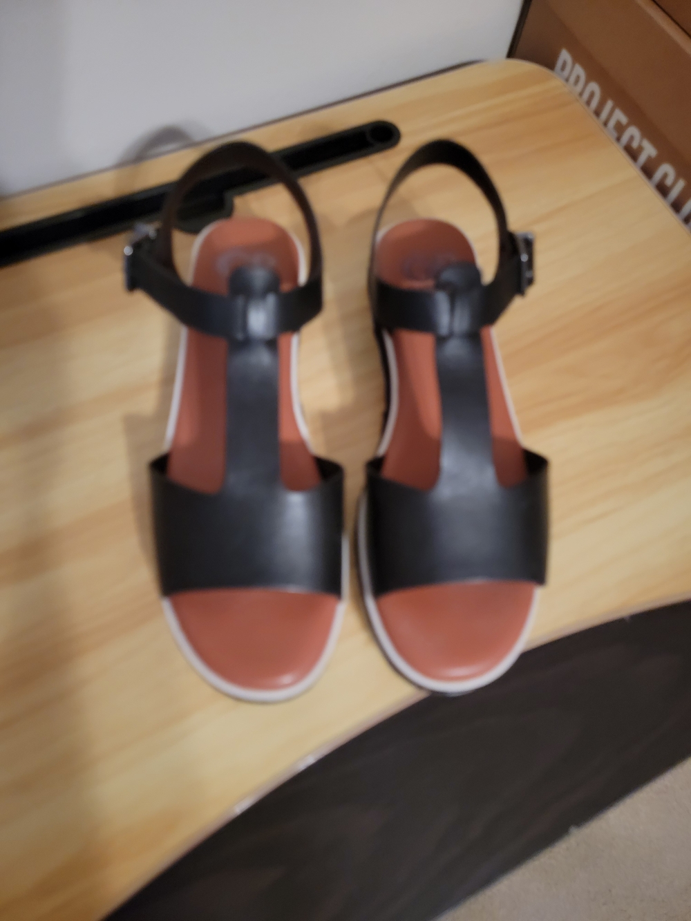 ANTONIO MELANI Black T-Strap Sandals with Brown Footbed